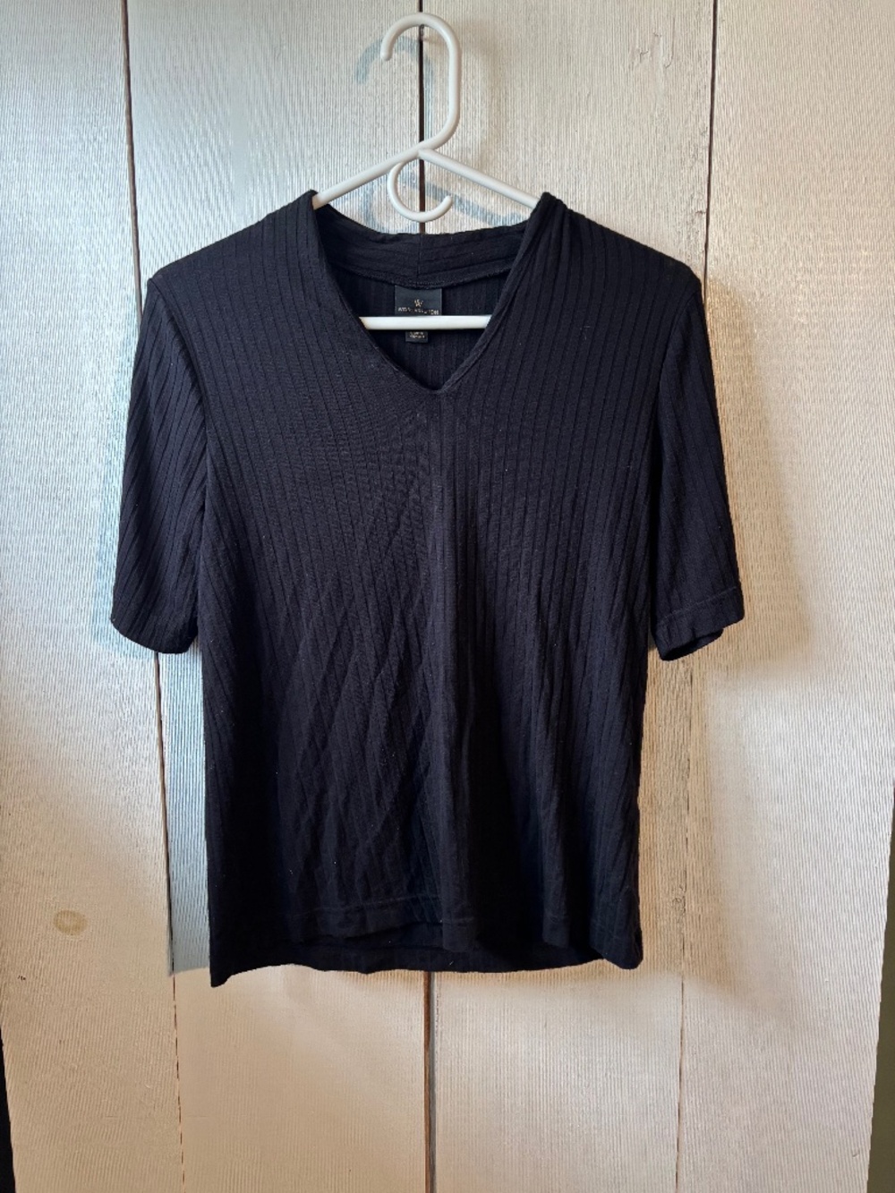 Woman’s black v neck short sleeve shirt